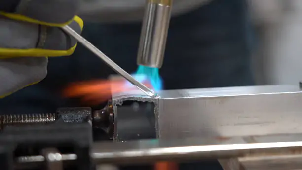 close up of Worker welding the aluminium